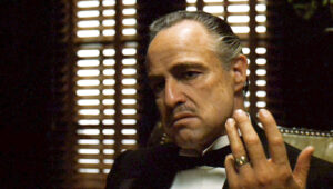 Marlon Brando playing Vito Corleone in the Godfather